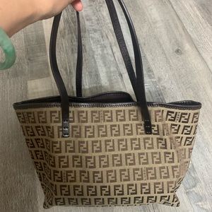 Authentic Preowned fendi small tote. Comes with a small coin pouch inside.